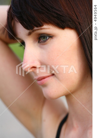 girl is posing against green 4949564