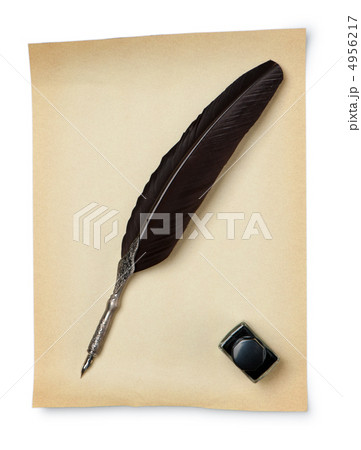 Feather quill and inkwell on an old paper Feather quill and inkwell on an old paper 4956217