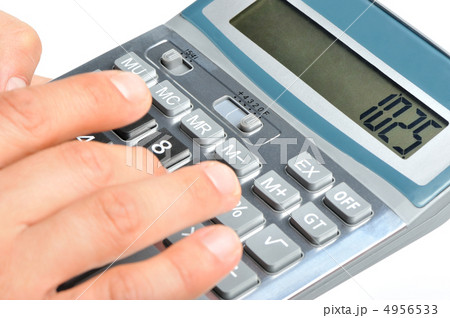 The calculator and a hand of the man The calculator and a hand of the man 4956533