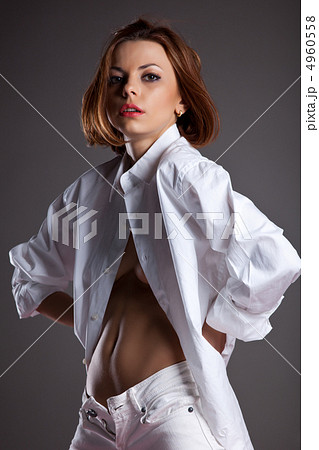 Desired young woman in white shirt undress jeans 4960558