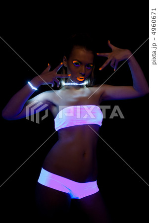 sexy girl with glow make-up in ultraviolet light 4960671