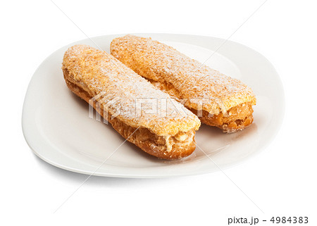 two tasty eclairs on dish 4984383