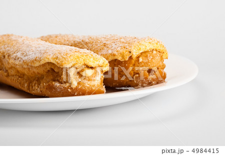 two eclairs on white dish 4984415