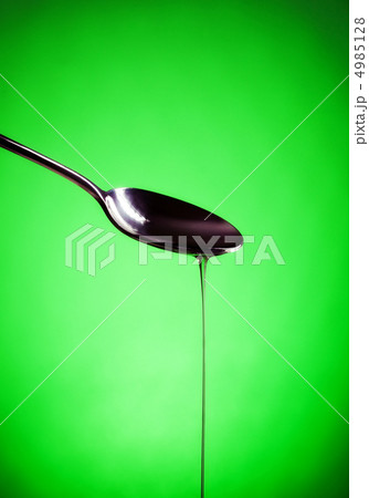 oil spill out of spoon oil spill out of spoon 4985128