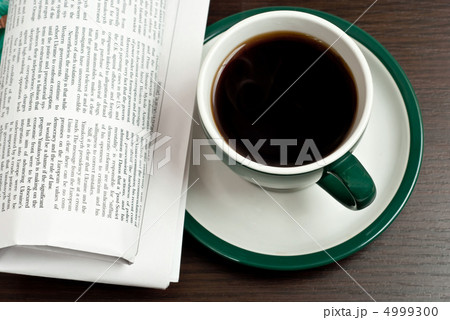 Hot coffee and newspaper 4999300