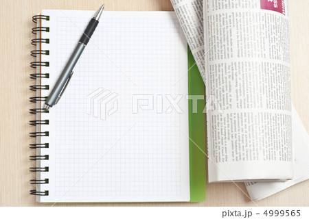 Notebook and newspaper 4999565