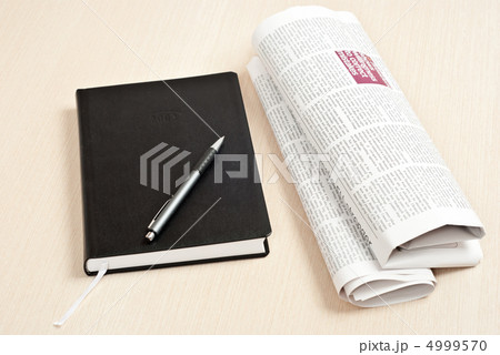 Notebook and newspaper 4999570