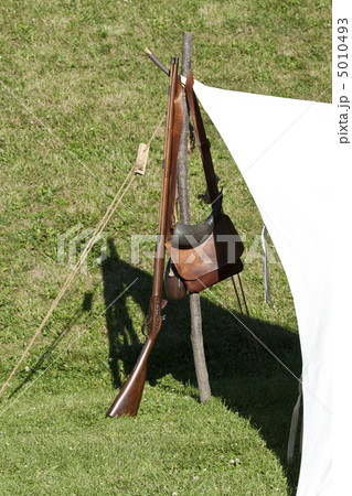 Old style Gun heanging in a stiak 5010493