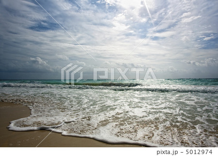 Golden shore hit by surf Golden shore hit by surf 5012974