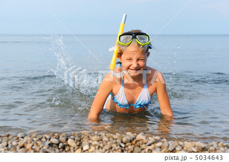 The girl on seacoast flounders about in water The girl on seacoast flounders about in water 5034643