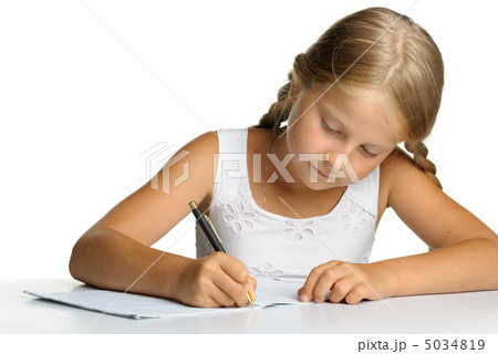 The girl writes to writing-books. The decision of lessons. 5034819