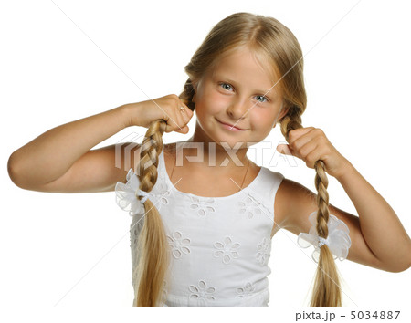 The pretty girl the blonde holding itself for braid The pretty girl the blonde holding itself for braid 5034887