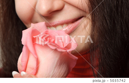 The woman with a rose closeup 5035742