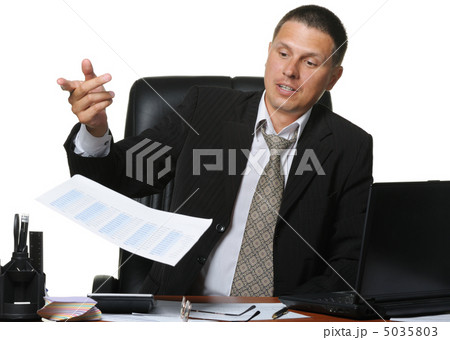 The businessman discontentedly throws the financial report 5035803