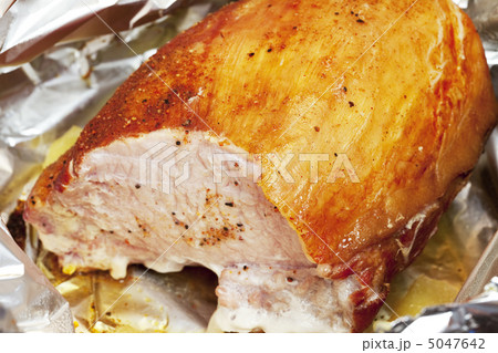large piece of meat in foil with spices 5047642