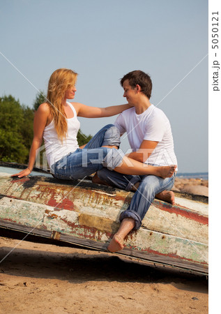 young couple on old boat young couple on old boat 5050121