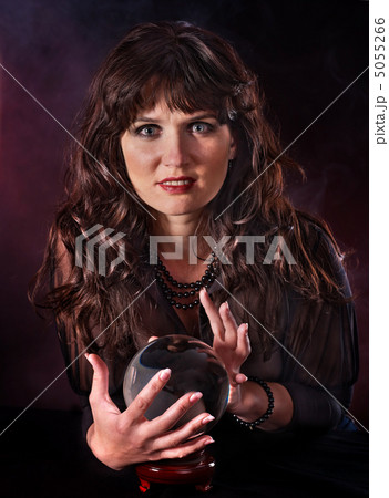 Young woman  with crystal ball. 5055266