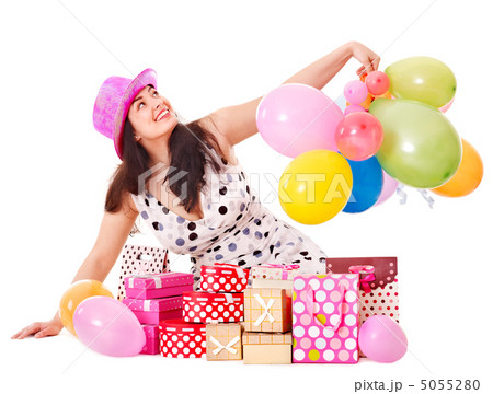 Woman holding gift box at birthday party. Woman holding gift box at birthday party. 5055280