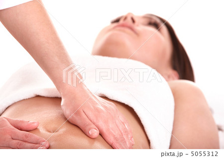 Young woman having stomach massage. 5055312
