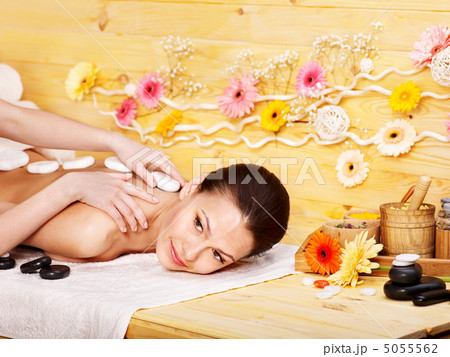 Woman getting stone therapy massage . Woman getting stone therapy massage . 5055562