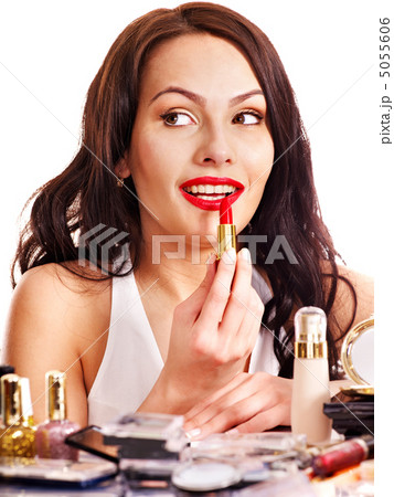 Girl applying makeup. 5055606