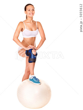 Woman with knee brace. Woman with knee brace. 5055612