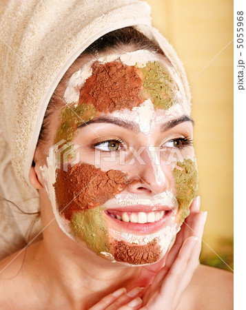 Woman with clay facial mask. 5055968
