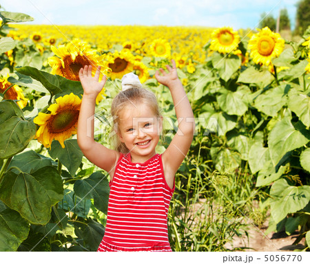 Kid holding sunflower outdoor. Kid holding sunflower outdoor. 5056770