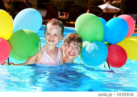 Children playing with balloons in swimming pool. Children playing with balloons in swimming pool. 5056916