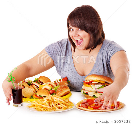 Woman eating fast food. Woman eating fast food. 5057238