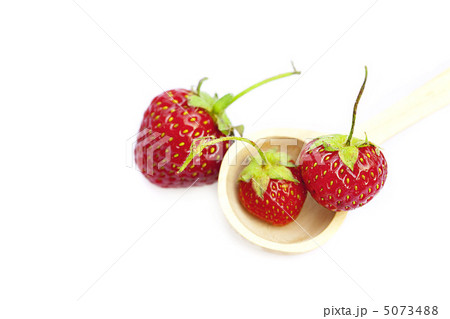 strawberry in a wooden spoon isolated on white strawberry in a wooden spoon isolated on white 5073488