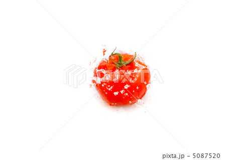 tomatoes with splashes of water isolated on white tomatoes with splashes of water isolated on white 5087520