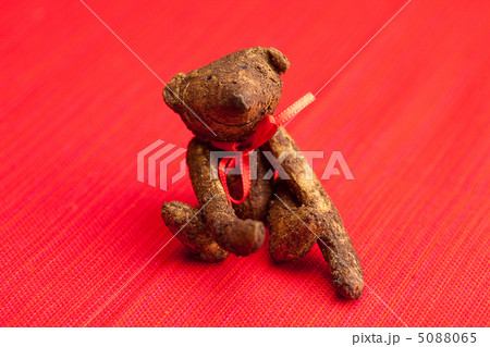 Teddy bear  handmade on a red background 5088065