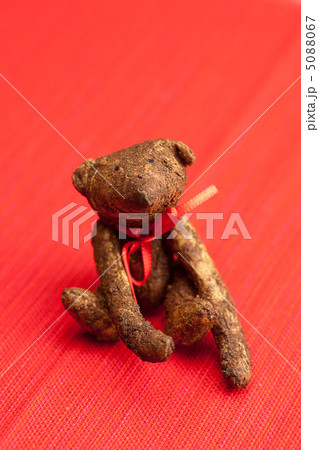 Teddy bear  handmade on a red background 5088067