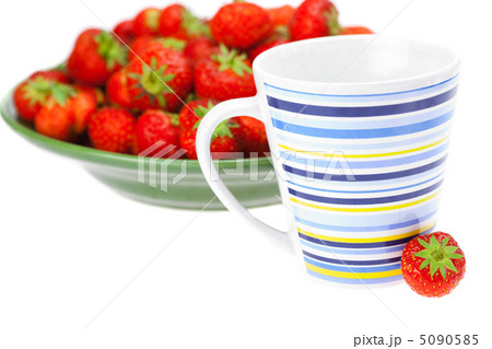 cup and saucer with strawberries isolated on white cup and saucer with strawberries isolated on white 5090585