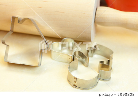 forms for the cookies, rolling pin and dough forms for the cookies, rolling pin and dough 5090808