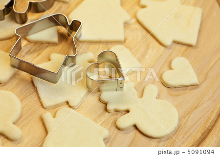 cut dough snowman, house, heart, and forms for cookies 5091094