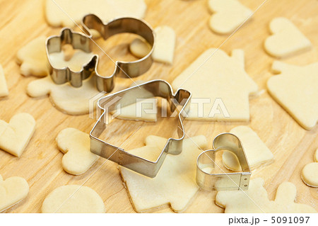 cut dough snowman, house, heart, and forms for cookies cut dough snowman, house, heart, and forms for cookies 5091097