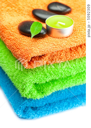 background of the three multi-colored bath towels, black spa sto background of the three multi-colored bath towels, black spa sto 5092309