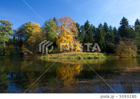 beautiful autumn landscape with colorful trees and a pond beautiful autumn landscape with colorful trees and a pond 5093280