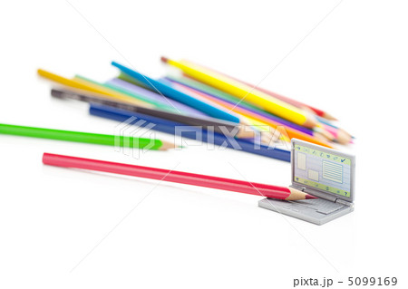 colored pencils and miniature laptop isolated on white 5099169