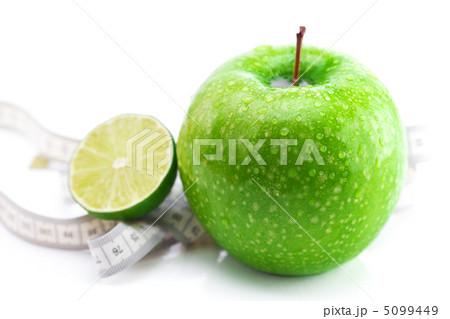 apple,lime and measure tape isolated on white 5099449