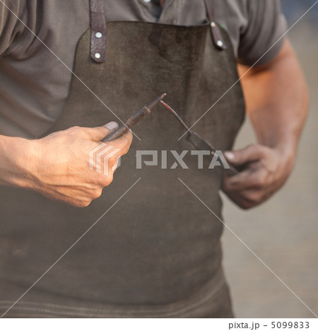 embers, fire, smoke, tools and the hands of a blacksmith embers, fire, smoke, tools and the hands of a blacksmith 5099833