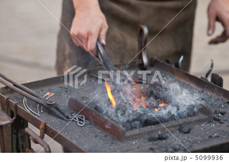 embers, fire, smoke, tools and the hands of a blacksmith embers, fire, smoke, tools and the hands of a blacksmith 5099936