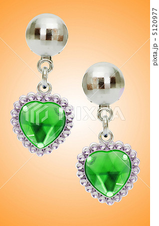 Silver earrings isolated on the white background Silver earrings isolated on the white background 5120977