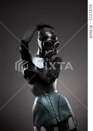 Woman in latex corset and gas mask Woman in latex corset and gas mask 5121639