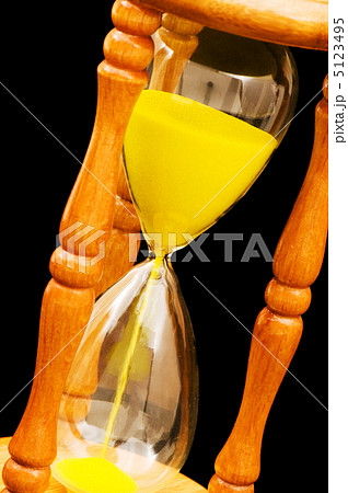 Wooden hourglass isolated on the black background 5123495