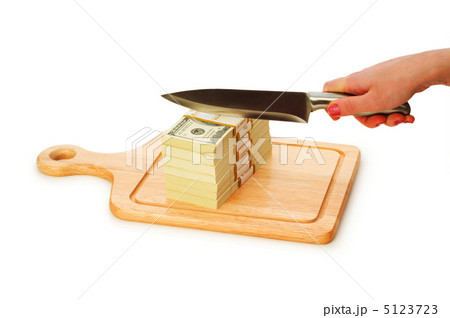 Money concept - cutting dollars with the knife Money concept - cutting dollars with the knife 5123723