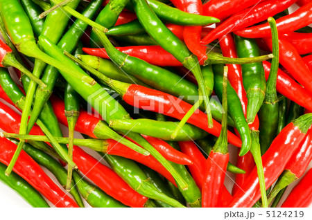Red and green chili peppers at the background Red and green chili peppers at the background 5124219