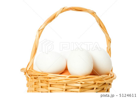 Basket full of eggs isolated on white Basket full of eggs isolated on white 5124611